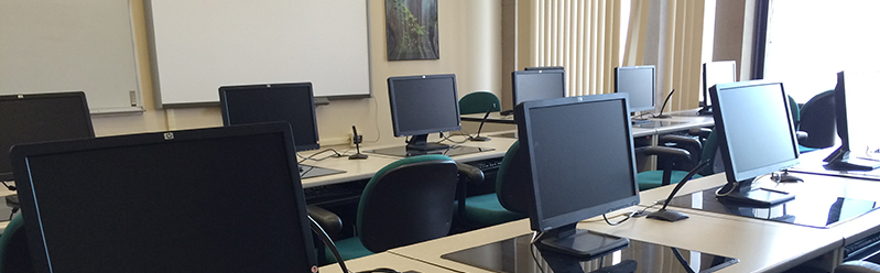 view of a training classroom with computers and chairs