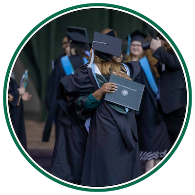 Students in cap and gown at graduation