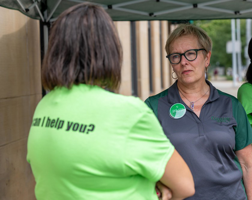 President Laura Bloomberg and a volunteer