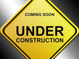 Yellow under construction sign