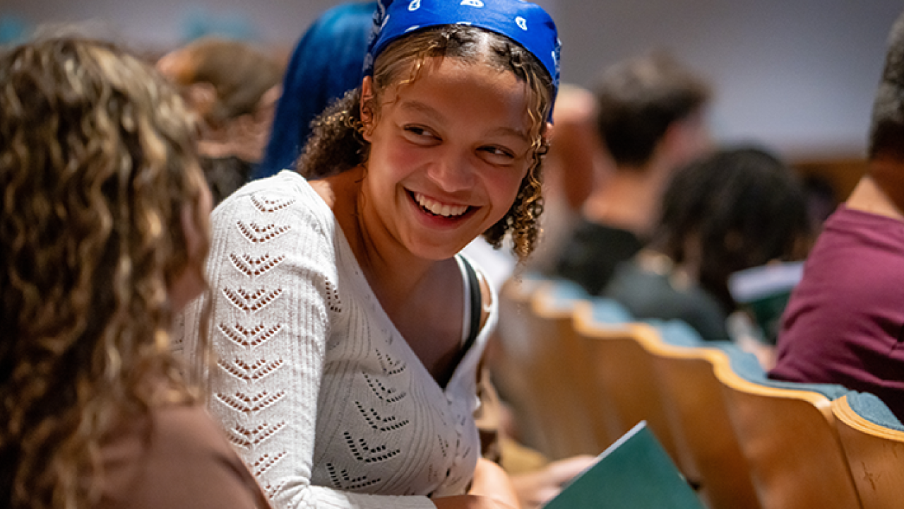 New Student Convocation - Young Woman in Blue Scarf Smiling