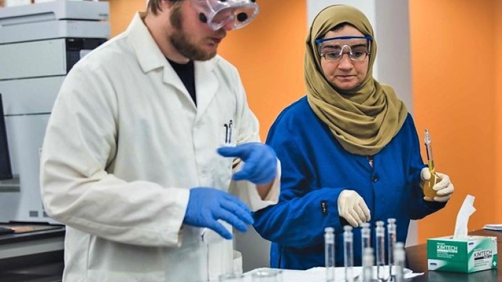 Pair of students working a lab