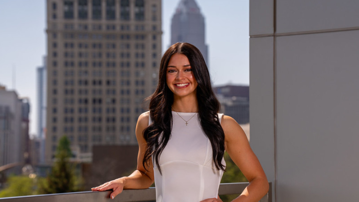 Sydney Wisno posing in front of CSU skyline