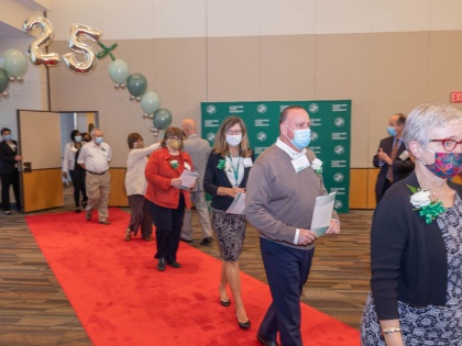 Employees entering on red carpet