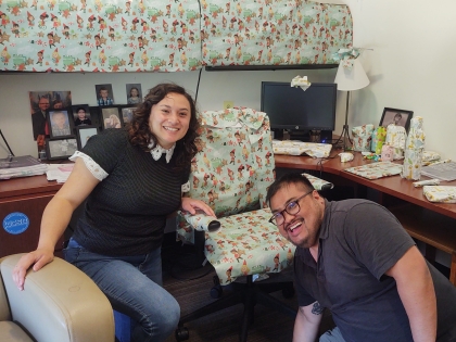 Two interns in an office where everything has been wrapped in wrapping paper as a prank