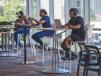Students at tables on laptops