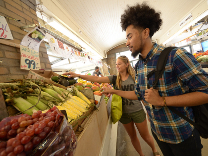 student shopping for produce